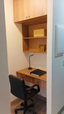 a desk with a chair and a laptop on it at 2BR 2BTH San Isidro Apartment in Lima