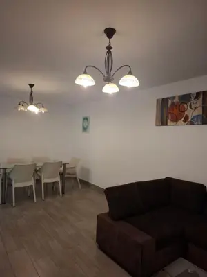 a living room with a couch and a table with chairs at J&B Aparment 1 Punta Hermosa in Punta Hermosa