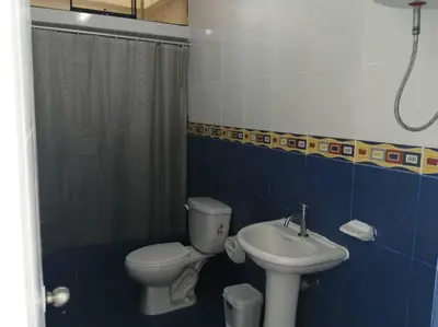 a bathroom with a toilet and a sink at J&B Aparment 1 Punta Hermosa in Punta Hermosa