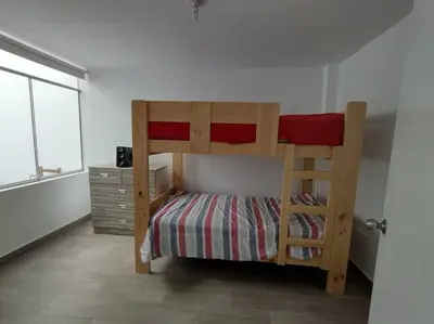 a bedroom with a bunk bed with a ladder at J&B Aparment 1 Punta Hermosa in Punta Hermosa
