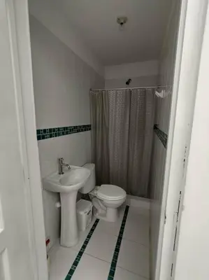 a bathroom with a toilet and a sink at J&B Aparment 1 Punta Hermosa in Punta Hermosa