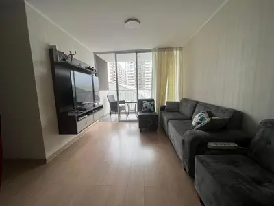 a living room with a couch and a flat screen tv at Moderno Apartamento en Condominio Alto Venezuela in Lima