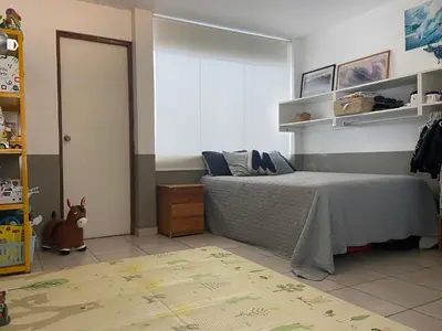 a childs bedroom with a bed and a window at Watermanhouse, Punta Hermosa in Lima