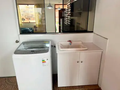 a small kitchen with a sink and a washing machine at San Miguel, 3 dormitorios, terraza wifi cochera in Lima