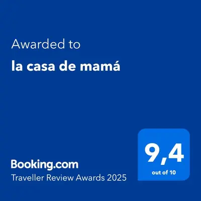 a blue text box with the words awarded to la casa de manana at la casa de mamá in Huayopata