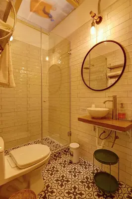 a bathroom with a toilet and a sink and a mirror at Casa Porta in Lima