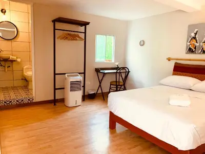 a bedroom with a bed and a bathroom at Casa Porta in Lima