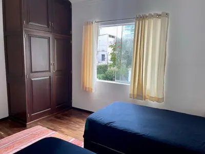 a bedroom with a bed and a window at Casaroma Hostels in Lima