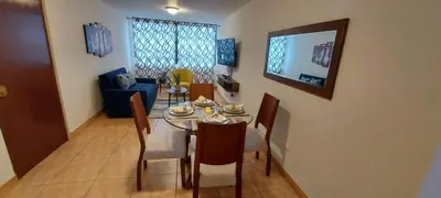 a dining room with a table and chairs at Warmisitay H O M E in Lima