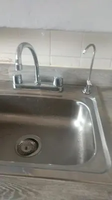 a sink with two faucets in a kitchen at Charming Miraflores Guesthouse with Terrace Studio Apartment and Private Room in Lima