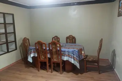 a dining room with a table and chairs at CASA HOSPEDAJE LA FLORIDA in Cusco