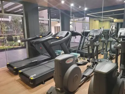 a gym with treadmills and elliptical machines at Apartment with incredible view, pool and gym in Lima