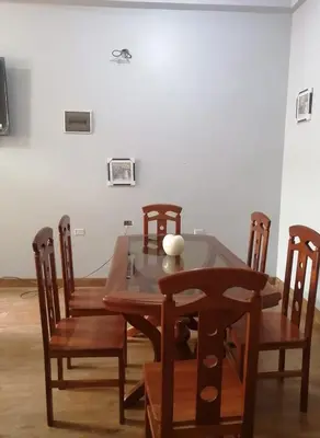 a dining room with a table and chairs at MI SELVA Y SU ENCANTO in La Merced