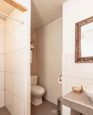 a bathroom with a toilet and a sink at SAMANA B&B in Cusco