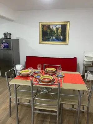 a table with plates and wine glasses on it at (24)Dpto de estreno en el corazón de Miraflores in Lima