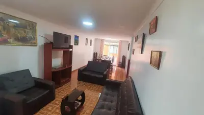 a living room with a couch and a chair at Hospedaje Mary House - En el corazón del Cusco in Cusco