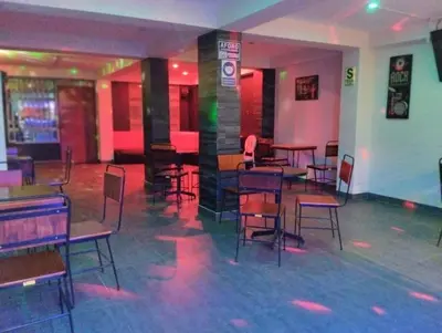 a dining room with tables and chairs in a restaurant at Brianny Hotel in Churín