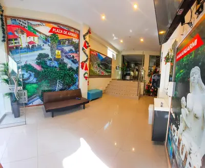 a lobby of a store with a couch in the middle at Brianny Hotel in Churín