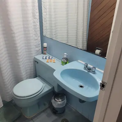 a bathroom with a toilet and a sink at The Guest House 1 at the booming center of Miraflores, Lima - Peru in Lima