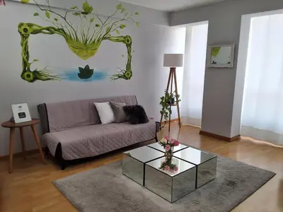 a living room with a couch and a glass table at Miraflores View in Lima