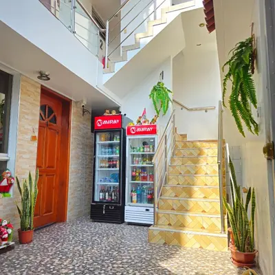 a store with a drink cooler next to a staircase at Hospedaje Celerina & Elio in Lima