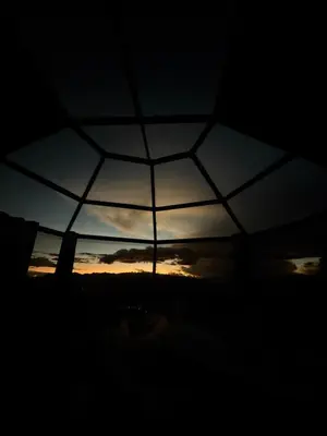 a view of the sunset through an umbrella at Sky Dome Peru in Cusco
