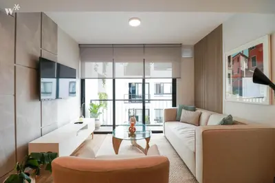 a living room with a couch and a table at Colon by Wynwood House in Lima