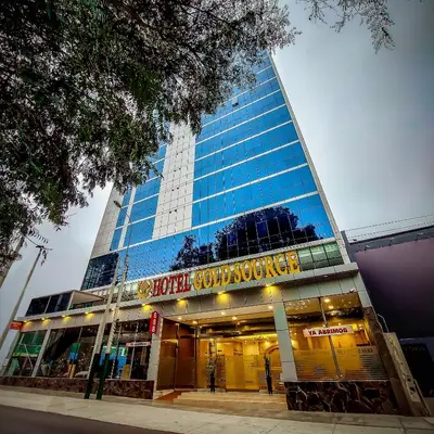 a hospital building with a sign in front of it at Gold Source Hotel in Lima